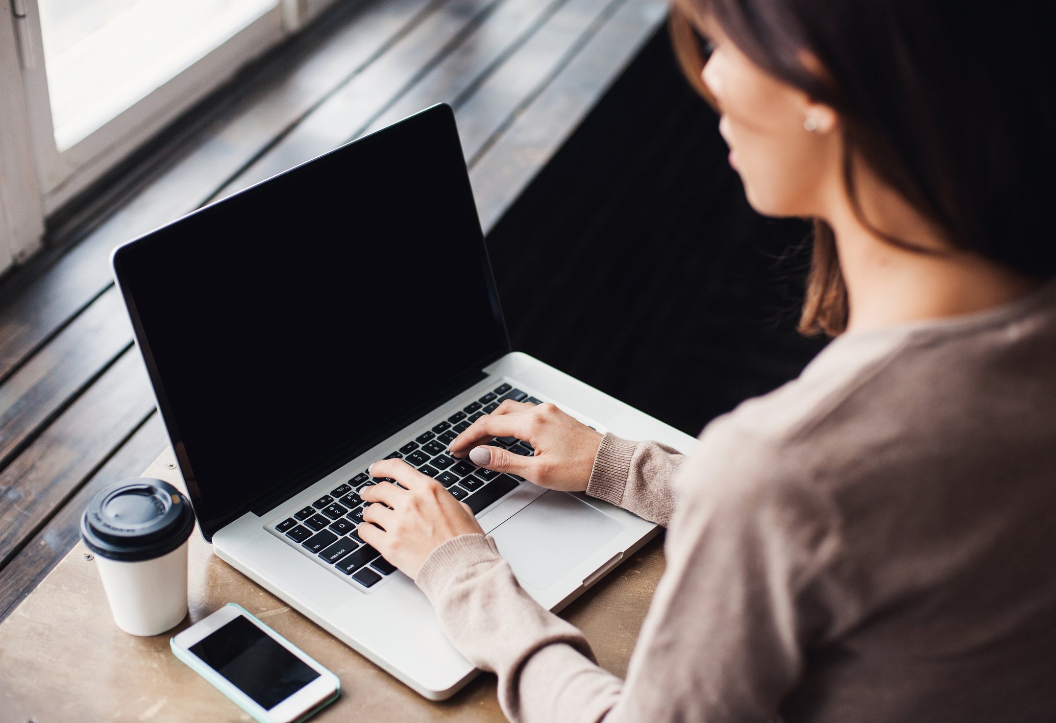 Businesswoman is using laptop computer